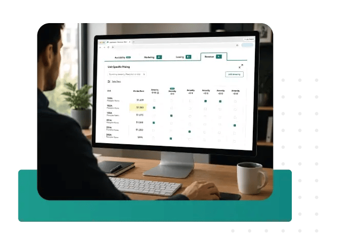 Man working on a desktop that shows a Revenue Management Platform