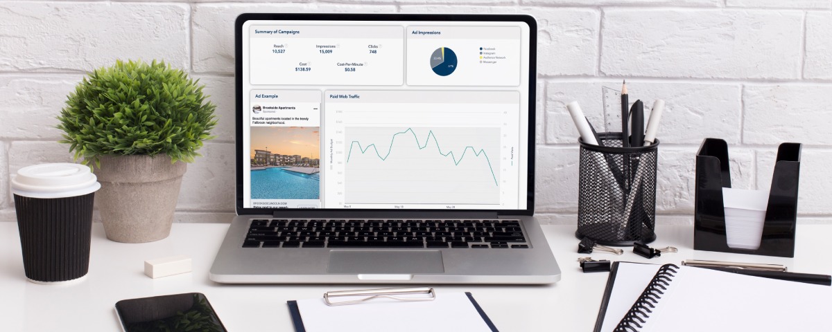 Apartment marketing metrics and performance data displayed on a laptop. 