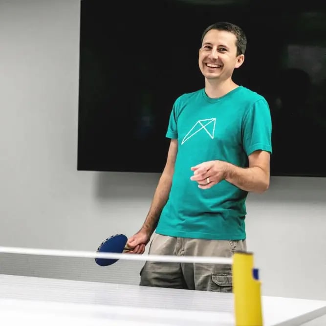 RentVision employee playing ping pong