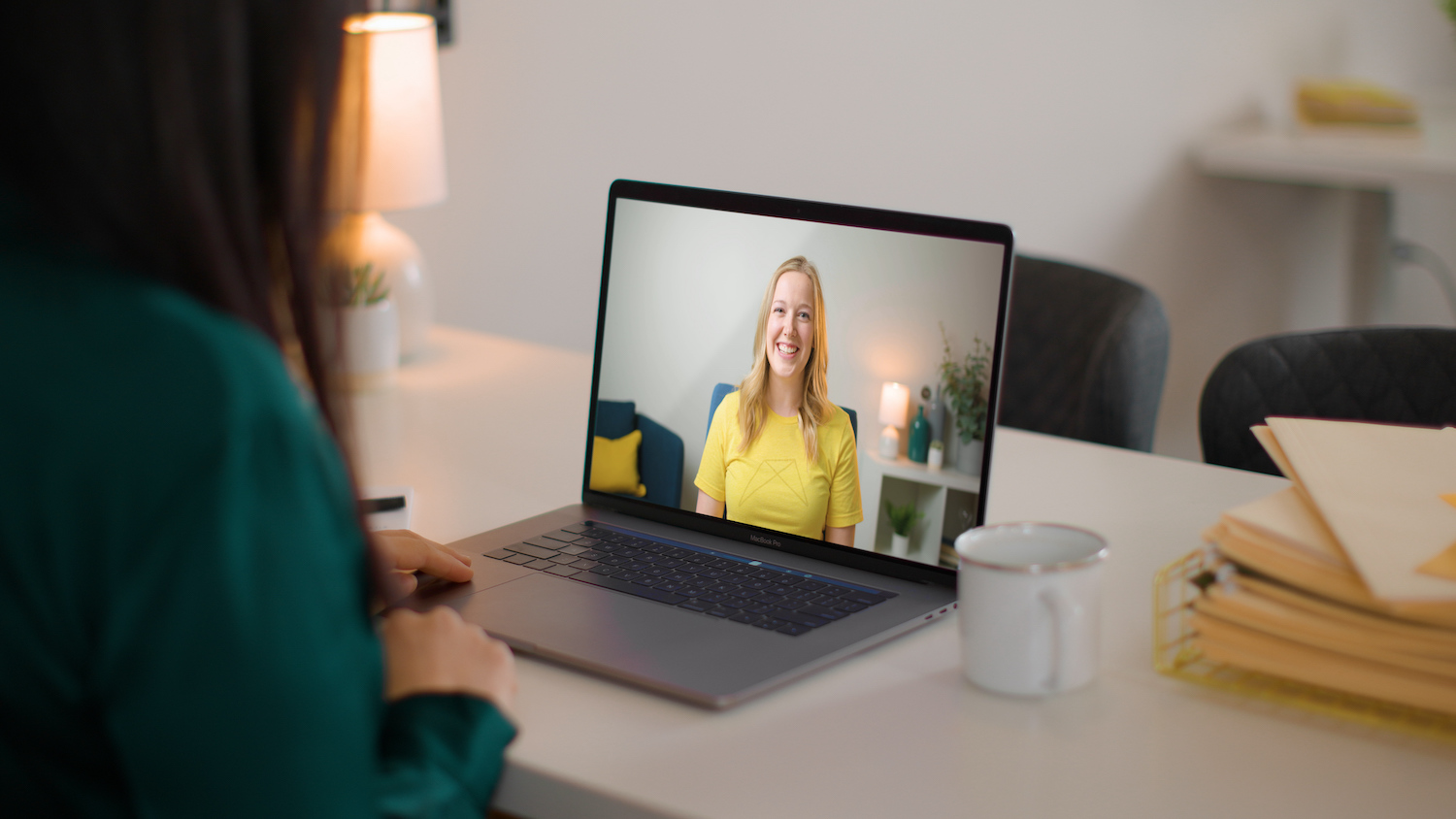 Person looking at a Zoom call with a RentVision Advisor on a laptop computer.
