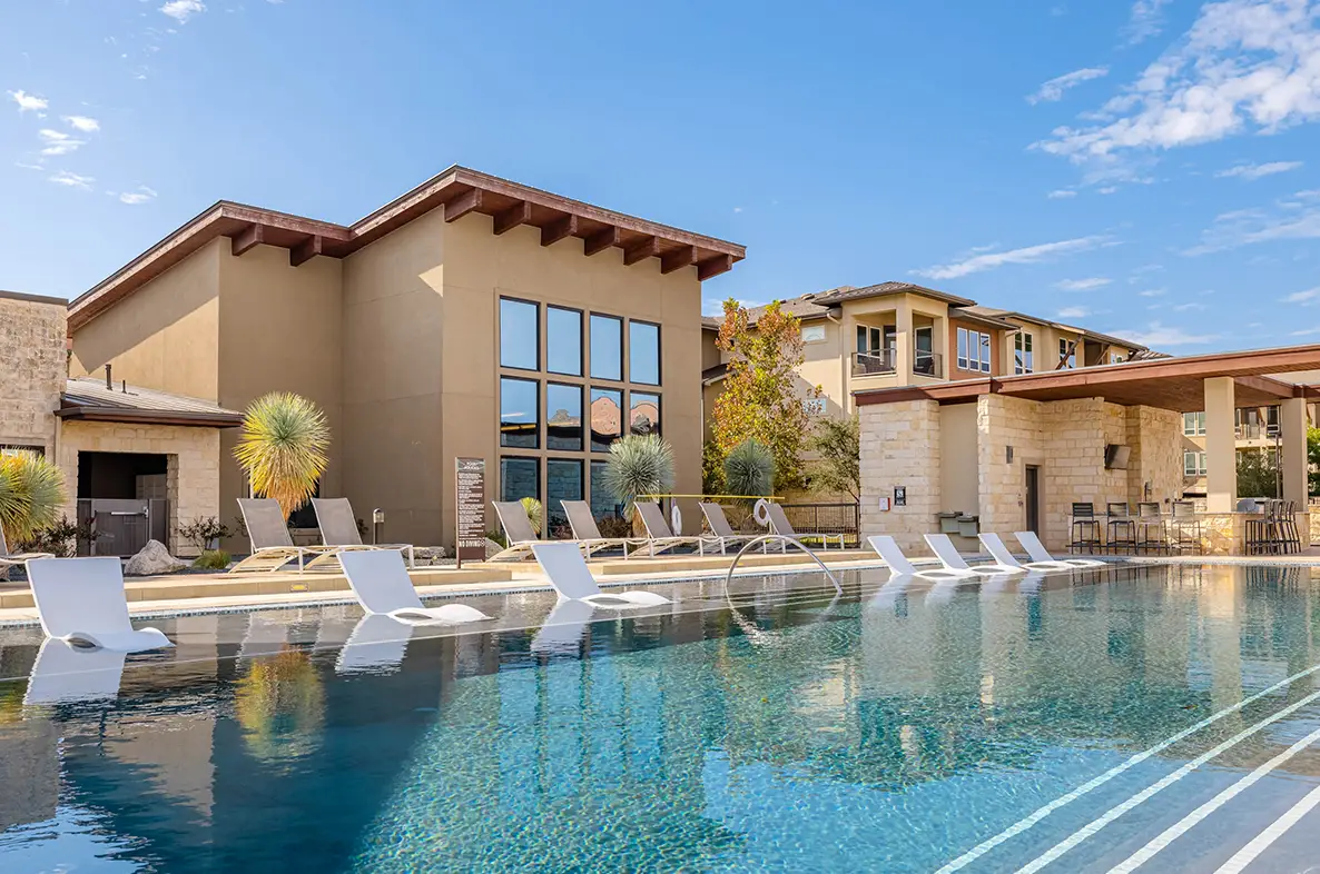 Beautiful pool in front with luxury apartment community