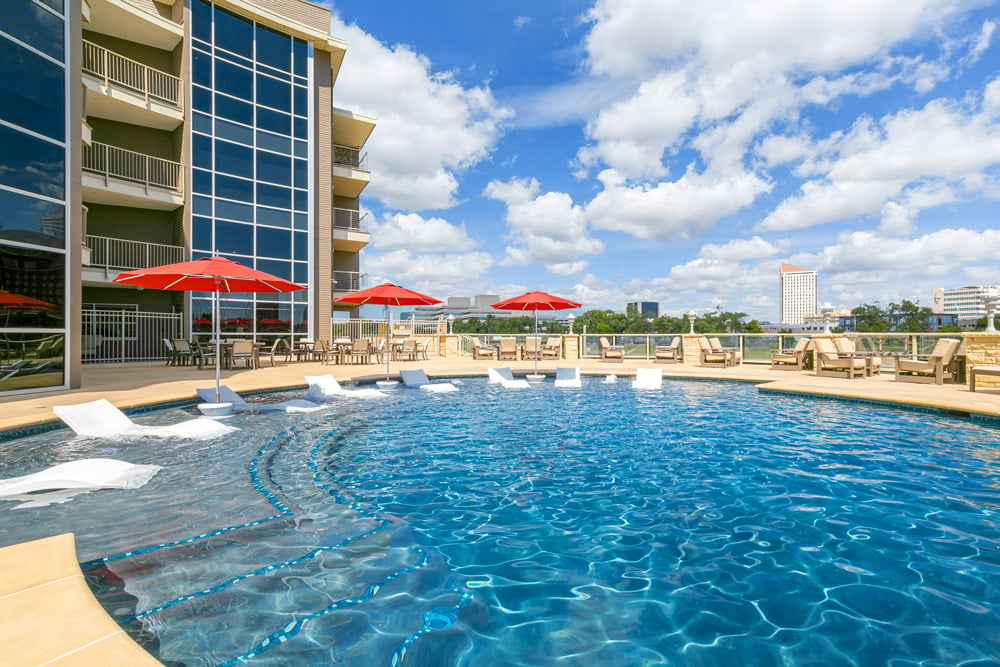 Community pool and lounge area after editing with vivid lighting